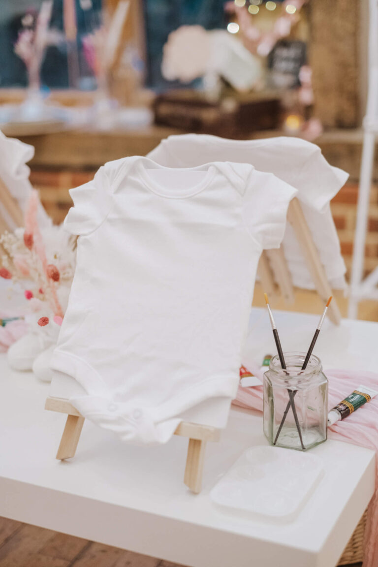 Decorating a plain tee with fabric pens at the craft table