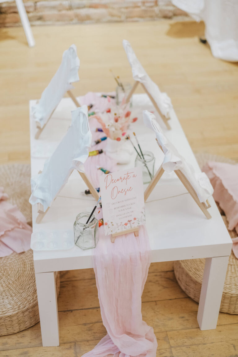 Mini easels set up on a kids' activity table