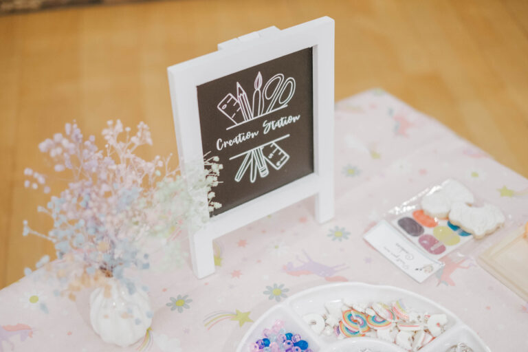 Gypsophila posy beside a chalkboard sign