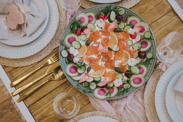 Top-down platter with gold cutlery at a luxe picnic